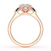 Oval trilogy engagement ring with trillion shaped blue sapphire side stones