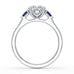 Oval trilogy engagement ring with trillion shaped blue sapphire side stones