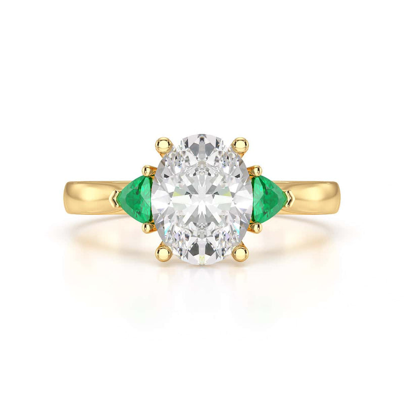 Oval trilogy with trillion side stones Dress ring