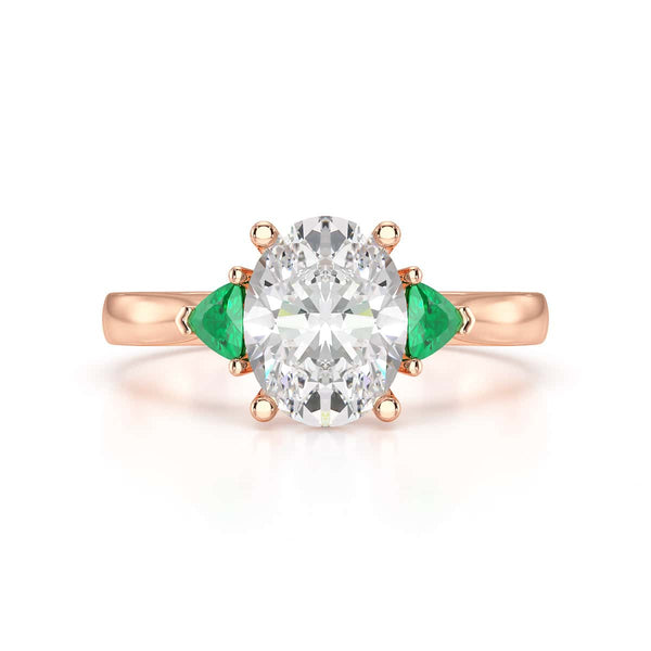 Oval trilogy with trillion side stones Dress ring