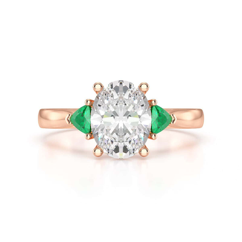 Oval trilogy with trillion side stones Dress ring