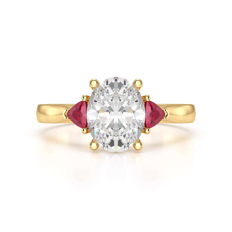 Oval trilogy engagement ring with trillion shape ruby