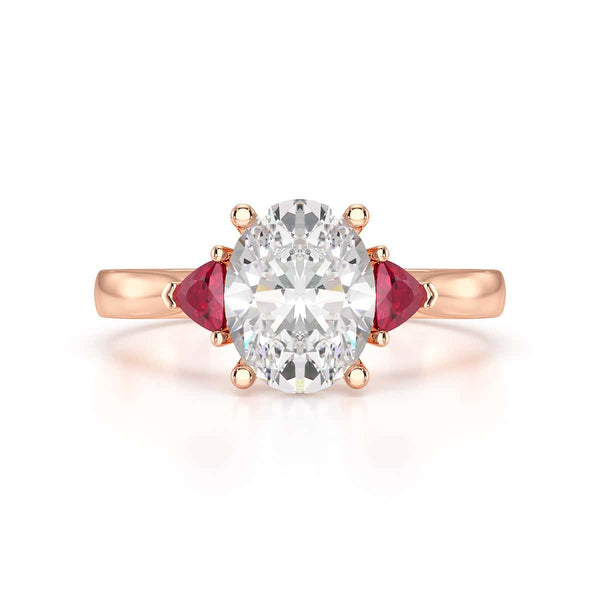 Oval trilogy engagement ring with trillion shape ruby