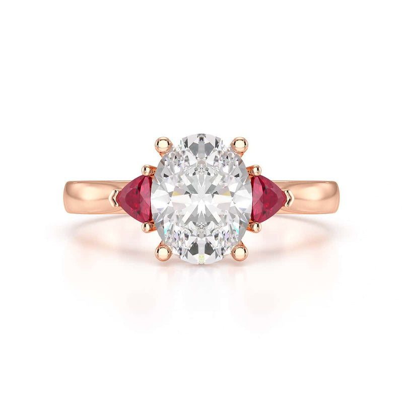 Oval trilogy engagement ring with trillion shape ruby