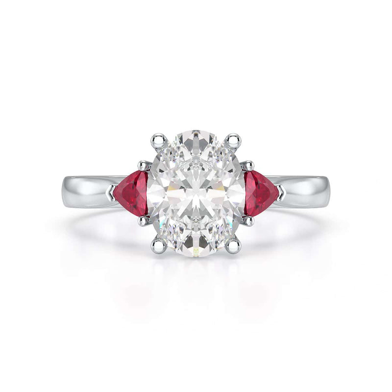 Oval trilogy engagement ring with trillion shape ruby