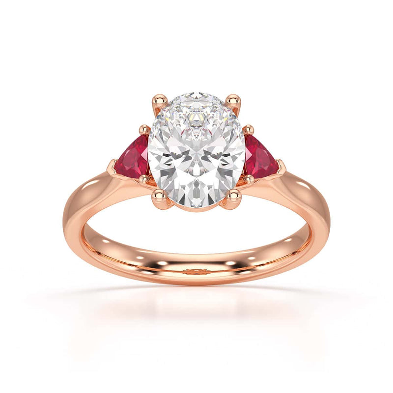 Oval trilogy engagement ring with trillion shape ruby