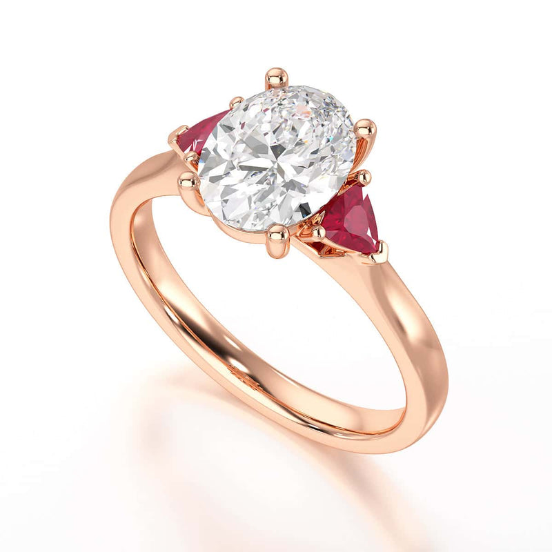 Oval trilogy engagement ring with trillion shape ruby