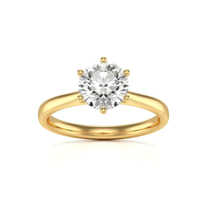 Gold ring with a large diamond on a white background