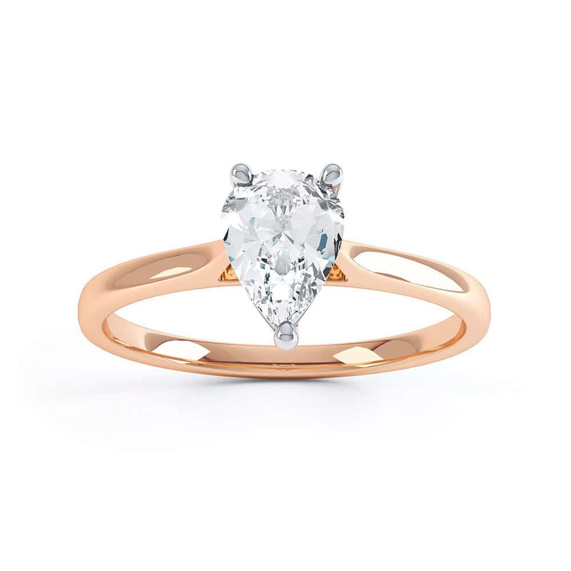 Diamond Solitaire Engagement Ring with a Pear Shape Diamond and Tapered Shoulders