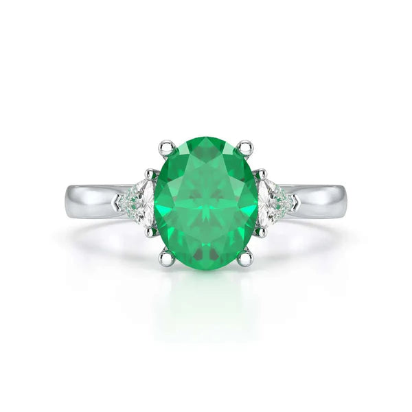 18ct Rose gold Emerald oval center with trillion shaped  rings