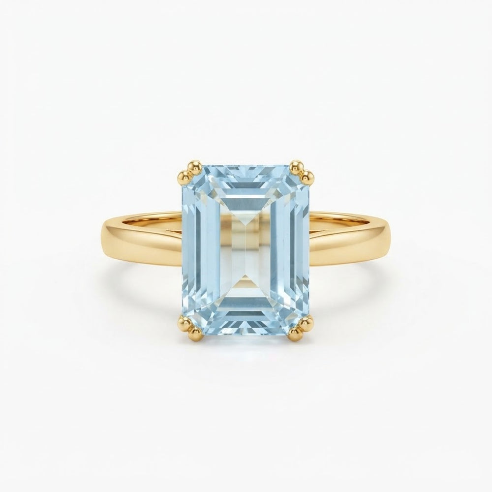 Emerald-Cut Aquamarine Solitaire Ring in Yellow Gold