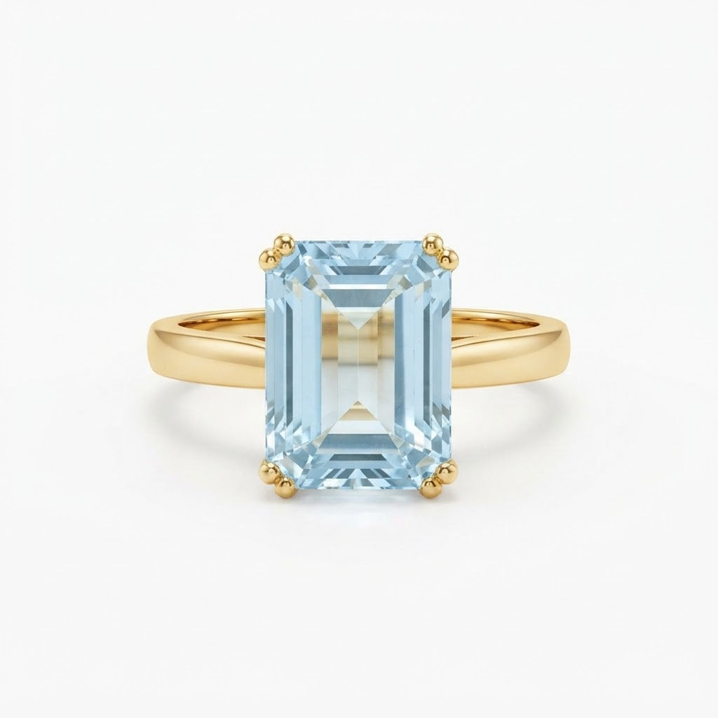 Emerald-Cut Aquamarine Solitaire Ring in Yellow Gold