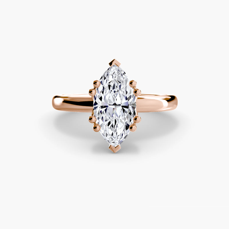 Rose gold ring with a pear-shaped diamond 