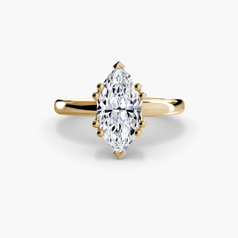 Gold ring with a marquise-shaped diamond 