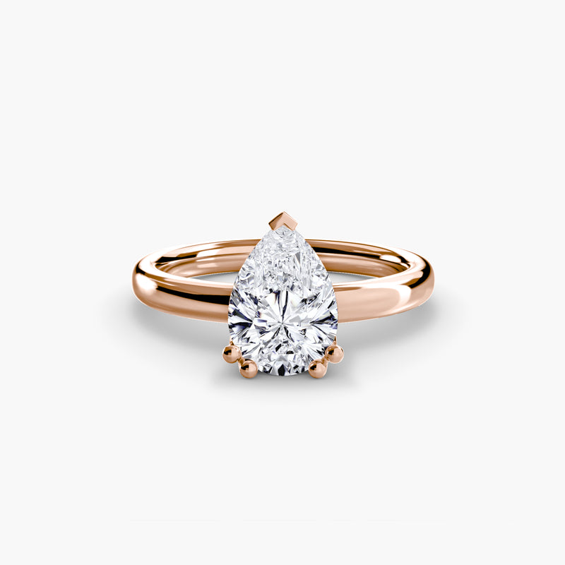 Rose gold ring with a pear-shaped diamond 