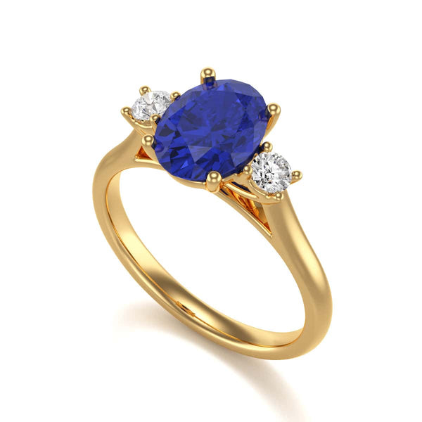 Oval Shape Trilogy Blue Sapphire Engagement Ring in 18ct Gold and Platinum