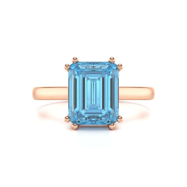 Emerald Cut Blue Topaz Solitaire Dress Ring
